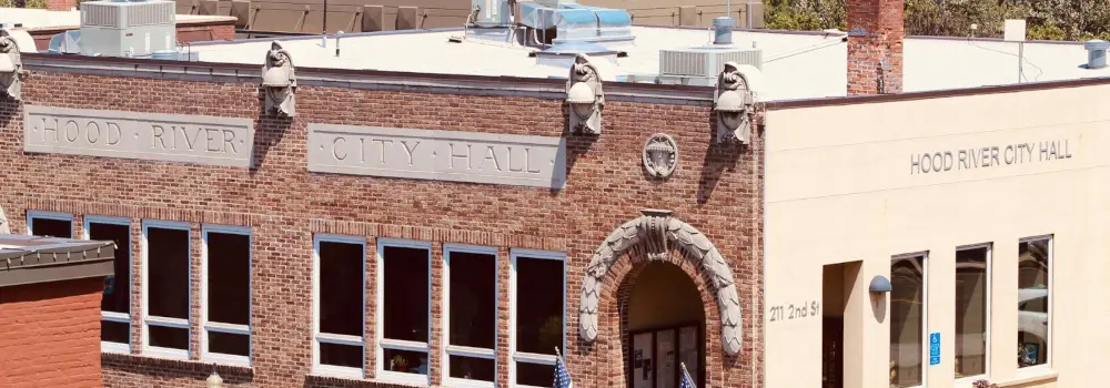 Hood River City Hall building with brick facade and arched entrance.
