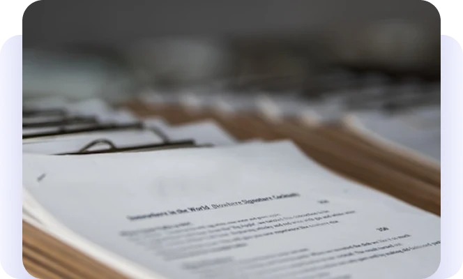 Close-up of paper records organized in file folders.